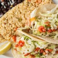 Fish Tacos · 2 soft corn tortillas filled with blackened and grilled cape capensis, chipotle mayonnaise.