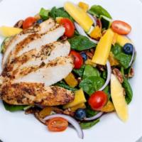 Spinach Salad · Gluten-free. Grilled chicken, cherry tomatoes, apples, red onion, and candied pecans with di...