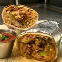 Fajita Burrito · Choice of meat, rice, pinto beans, grilled bell peppers, grilled onions and shredded cheese.