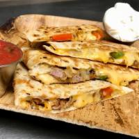 Steak Deluxe · Grilled steak, Monterey Jack, Cheddar cheese, grilled bell peppers and grilled onions. Add p...