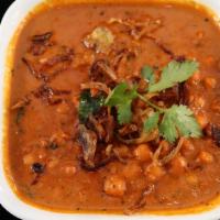 Channa Masala · Chickpeas cooked with onions, tomatoes, potatoes, spices and fresh herbs.
