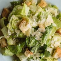 Caesar Salad · Hearts of romaine, lemon garlic croutons, with house-made caesar dressing, shaved Parmigiano