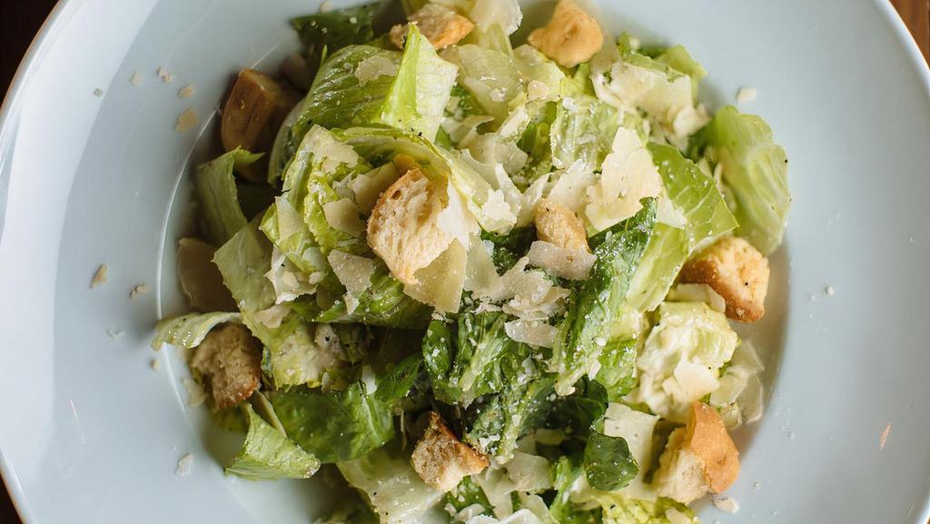 Caesar Salad · Hearts of romaine, lemon garlic croutons, with house-made caesar dressing, shaved Parmigiano