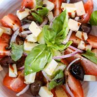 Pomodoro Salad · Tomatoes, cucumber, fresh basil, black olives, red onion, Provola Dolce, EVOO, balsamic redu...