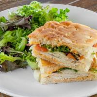 Turkey & Swiss Panino · In-house, Tuscan herb-roasted turkey, baby Swiss, roasted red pepper spread, mixed greens, a...