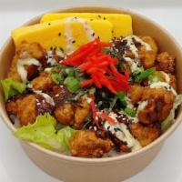 Chicken Karaage Donburi · Delicious bowl of Sushi rice and lettuce topped with Chicken Karaage, eggs, toasted sesame s...