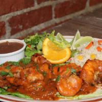 Carne Asada Con Camarones / Carne Asada With Shrimps · Bistec y camarón. Servido con arroz, frijoles refritos y ensalada. / Steak and shrimp. Serve...