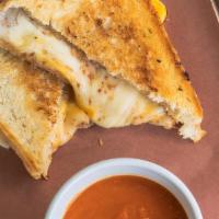 The Big Cheese · Cheddar, Provolone, Swiss, & American on Sourdough. Served with Roasted Red Pepper Tomato Bi...