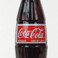 Mexican Coke · Made with cane sugar (no high fructose corn syrup).