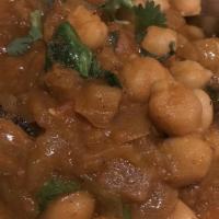 Channa Masala · Garbanzo bean cooked with onions, tomato and spices.