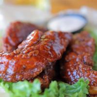 Hot Young Tenders · Grilled or fried chicken tossed in hot tomato chutney.