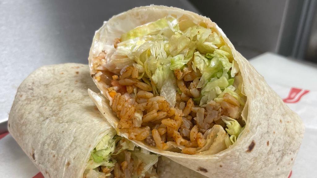 Really-Big-Burrito · Ground beef, refried beans, rice, lettuce, cheese and sour cream wrapped in a 12