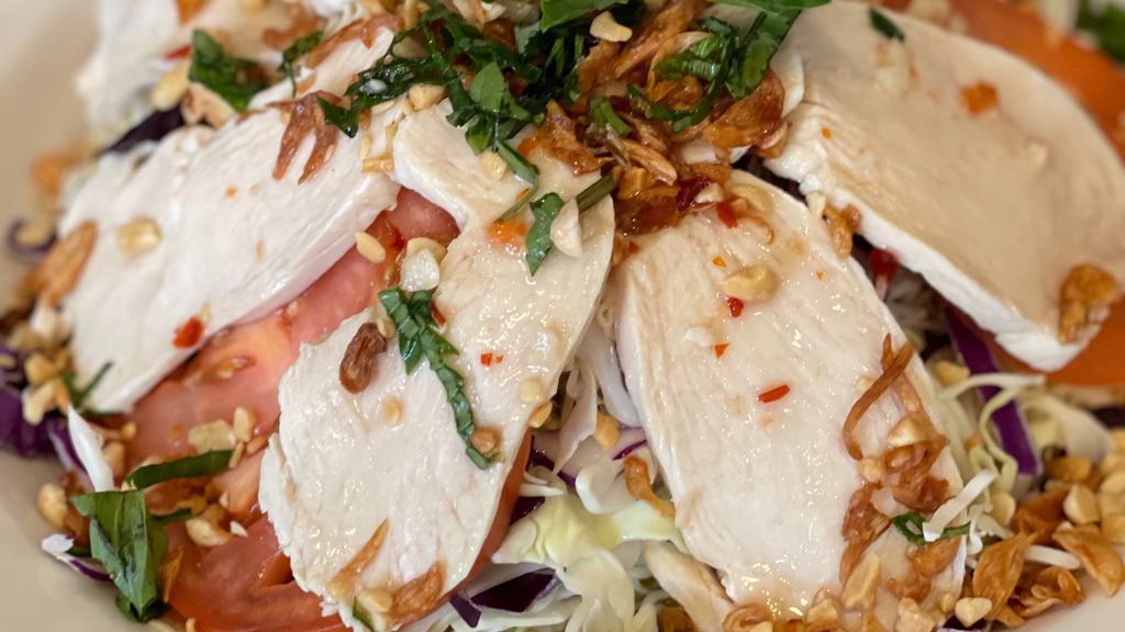 Chicken Cabbage Salad · Spicy. Salad consisting of slices of chicken, shredded cabbage, and tomatoes accompanied by fresh basil, crispy shallots and peanut toppings with a dash of sour and spicy dressing.
