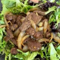 Luc Lac Beef · Vietnamese shaking beef sautéed with garlic, onion, butter, oyster sauce, and coated in a ri...