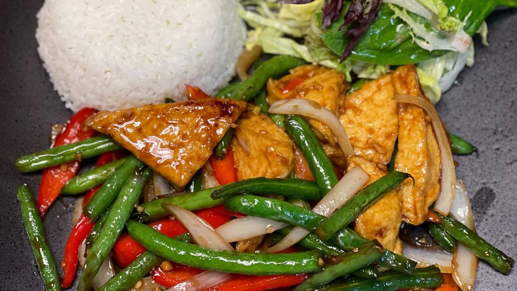 Green Bean · Stir-fry with refreshing green beans, onions, and red bell peppers served with spring mix salad covered in a light house dressing and steamed jasmine rice.