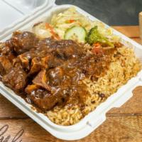 Oxtail · Oxtail with choice of two sides: rice and beans and cabbage