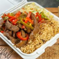 Pepper Steak · Delicious pepper steak with red and green bell peppers
Served with two side rice and beans a...