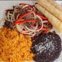 Grilled Steak Fajitas · Grilled Steak, Sauteed Peppers and Onions comes with beans and rice
