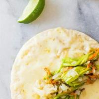 Squash Blossom Quesadillas · Homemade corn tortilla filled with melted Oaxacan cheese, caramalized onions, and squash blo...