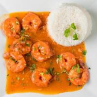 Camarones Al Ajillo · Shrimp in garlic sauce served with two options of either French fries, green salad, sweet pl...