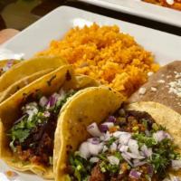 3 Taco Dinner · 3 steak, jerk chicken or ground beef tacos served with rice and beans