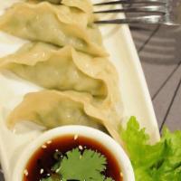 Pot Stickers · Pan-fried vegetable and mushrooms stuffed dumplings. Served with Thai ponzu sauce.