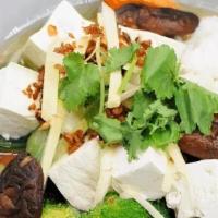 Tofu Rice Soup · Thai-style ginger rice soup with soft tofu, shiitake mushrooms, seasonal vegetables, and gin...