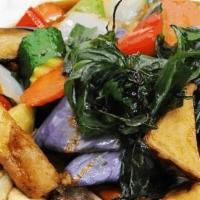 Phad Phet Makhua · Eggplants, fried tofu, carrots, onions, celery, mushrooms,
zucchini, bell peppers, cooked in...