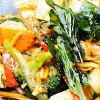 Spicy Noodle · Thin rice noodles, fried tofu, seasonal vegetables, bamboo shoots, mushrooms, hot basil, and...