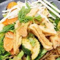 Rice Noodle With Tofu · Thin rice noodles, fried tofu, and seasonal vegetables, cooked in Thai seasoning, garlic oil...