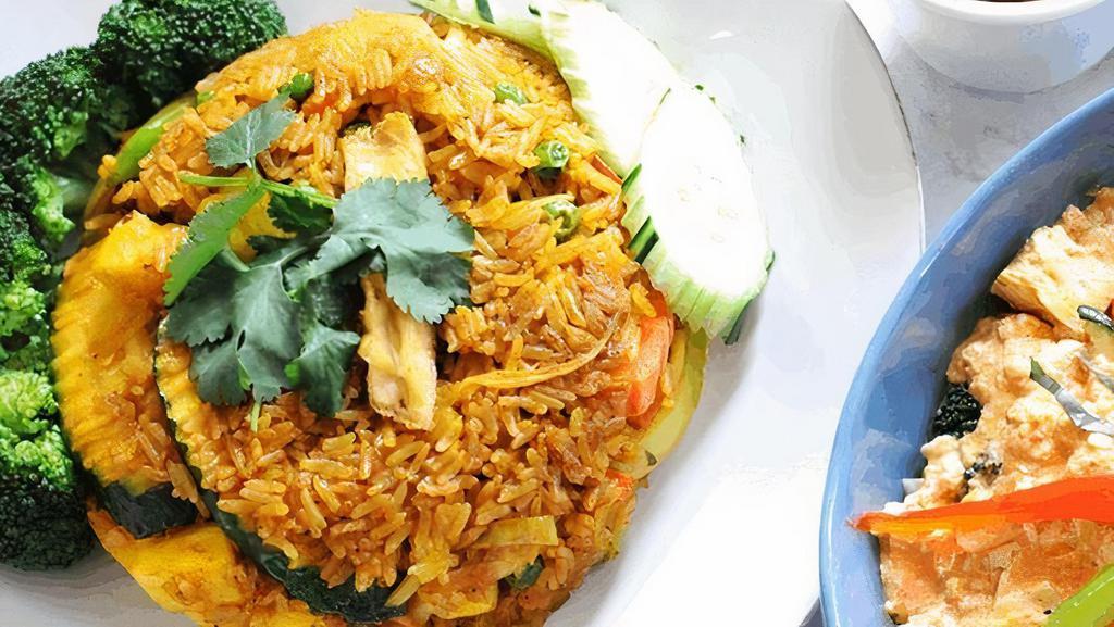 Pineapple Fried Rice · Seasonal vegetables, pineapples, onions, carrots, and fried tofu.
Stir-fried with jasmine rice and flavored with yellow curry seasoning. Topped with fried onions.