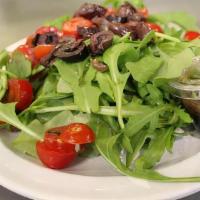 Side Salad · Baby arugula, cherry tomatoes, kalamata olives, and balsamic dressing.