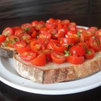 Bruschetta · Bread, cherry tomatoes, basil, and garlic.