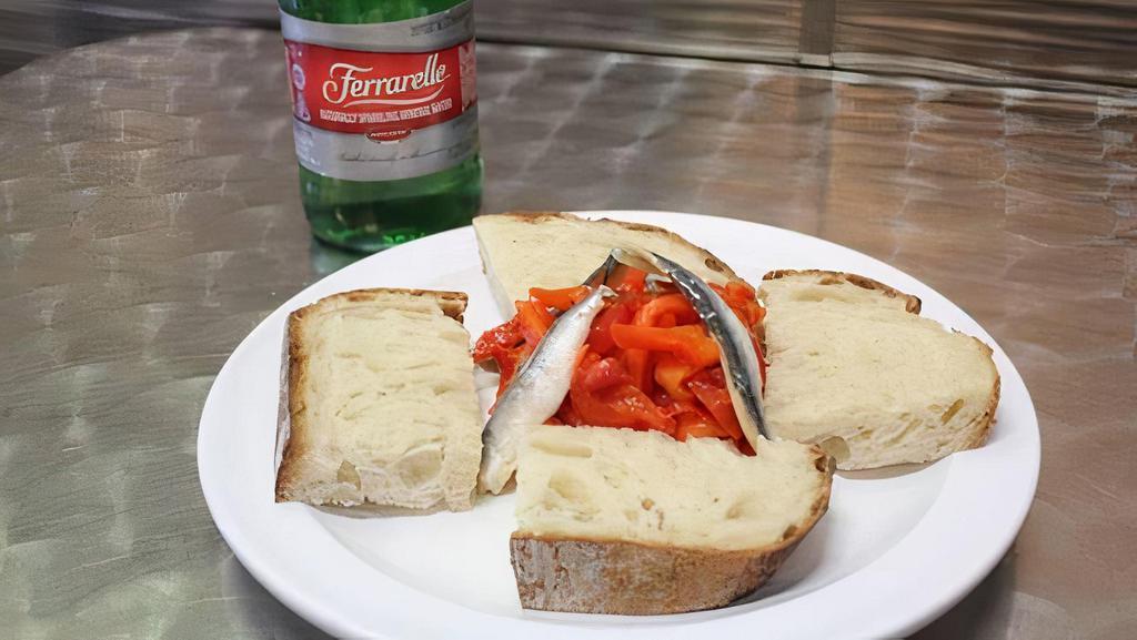 Crostini · With roasted red pepper, and white anchovy marinated in white wine, and bread.