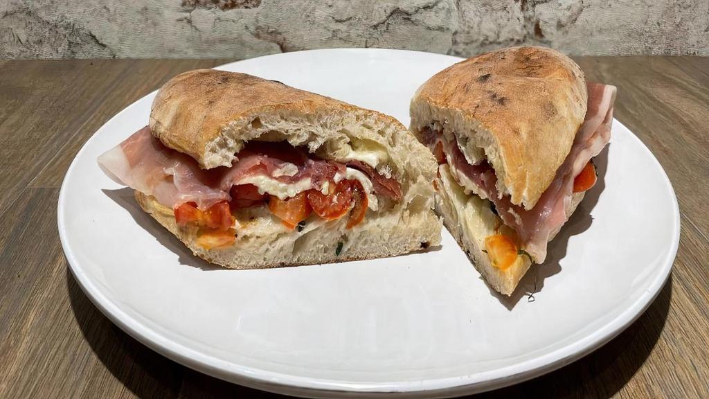 Pmt · Prosciutto di Parma, fresh mozzarella, basil, cherry tomatoes.over baked sandwiches.