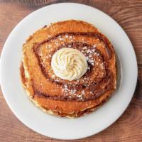 Cinnabunn · cinnamon swirl pancakes topped with cream cheese frosting