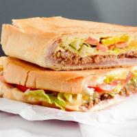 Cuban Sandwich · Pulled pork, ham, Swiss cheese, lettuce tomatoes and house sauce mayo and mustard. Served wi...