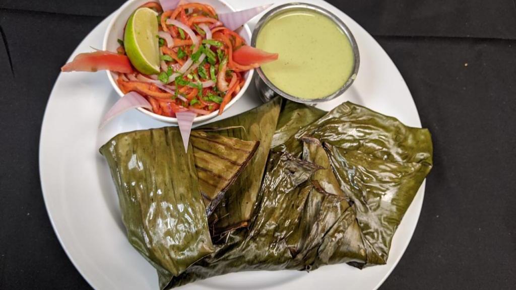 Meen Pollichathu (Pomfret) (Premium) · Whole Pomfret marinated, wrapped with Banana Leaves and cooked on grill top. (Kerala Style)