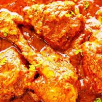 Vindaloo · Potato and a choice of meat cooked in a tangy and spicy red chili sauce.