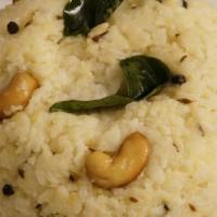 Ven Pongal · Rice and lentils cooked together, with black pepper, cumin and clarified butter.