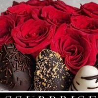 Box Type Arrangement · Red roses with chocolates in a medium box.