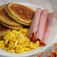 Pancakes · w/2 Eggs,Choice of Bacon,Sausage or Ham,Choice of Sm. Reg. Coffee,Sm. Reg.Tea or Sm.6 oz. Tr...