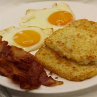 Hash Browns · w/ 2 Eggs,Choice of Bacon,Sausage or Ham,Choice of sm. reg. coffee,sm. reg. tea or 6 oz. Tro...