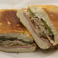 Cuban Sandwich · w/Roast Pork,Ham, Swiss Cheese  and Pickle,Lettuce and Tomatoes