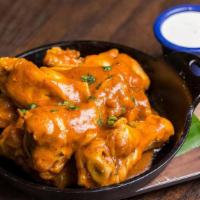 Mexican Buffalo Wings · 10 wings with our Mexican twist on a classic favorite served buffalo-style with ranch dip.