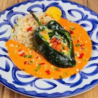 Chile Relleno Especial · Fresh Pasilla Chile filled with cheese then grilled and placed on a bed of relleno sauce & b...