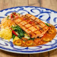 Salmon Veracruz · Grilled filet of salmon in jalapeño butter with salsa Veracruz, served atop fresh spinach an...
