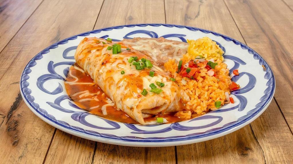 Burrito Especial - Beef Barbacoa · Seasoned shredded beef, jack cheese and ranchera sauce. Served with refried beans and rice.