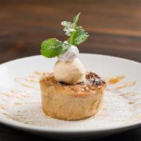 Mexican Bread Pudding · Our house made bread pudding is served warm and drizzled with caramel sauce, topped with ice...