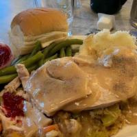 Fresh Oven Roasted Turkey · Slow roasted, hand carved turkey breast over stuffing topped with gravy and served with mash...
